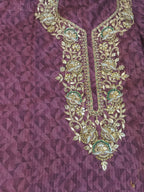 Purple Embroidered Kurta Set Highlighting Its Traditional Design and Vibrant Color