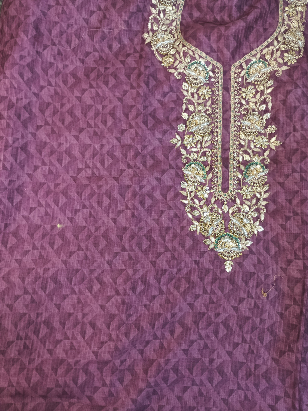Purple Embroidered Kurta Set Highlighting Its Traditional Design and Vibrant Color