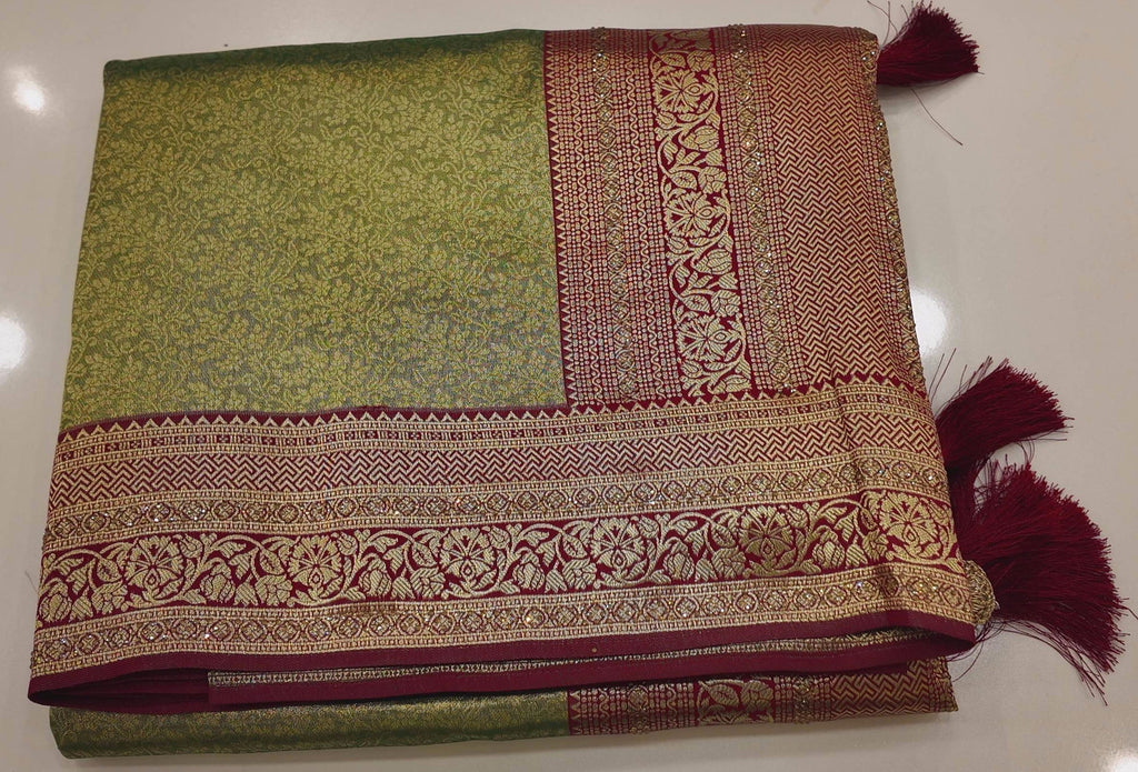 Regal Green and Maroon Saree with Intricate Floral Motifs",