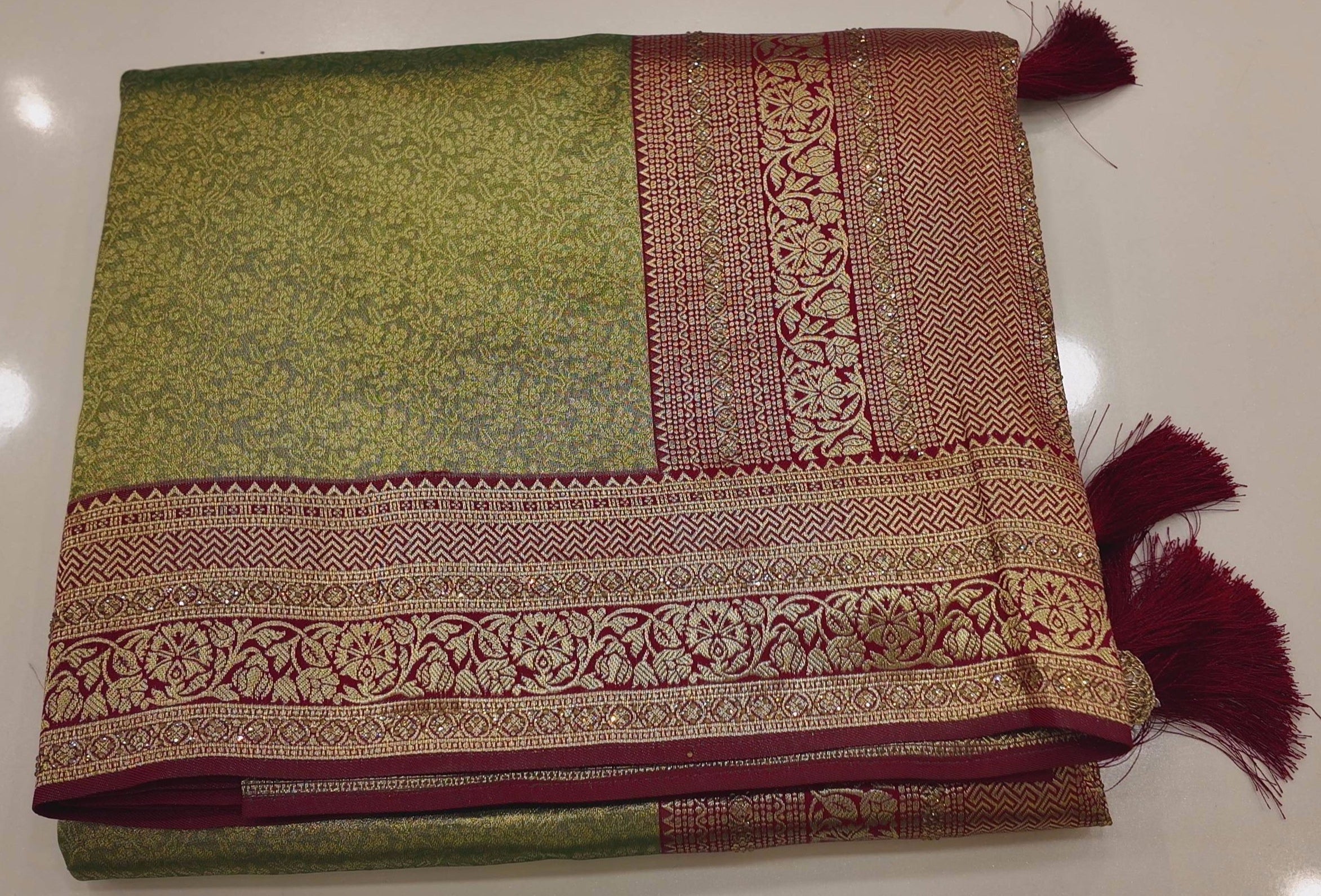 Regal Green and Maroon Saree with Intricate Floral Motifs",