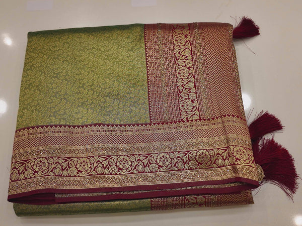 Regal Green and Maroon Saree with Intricate Floral Motifs",