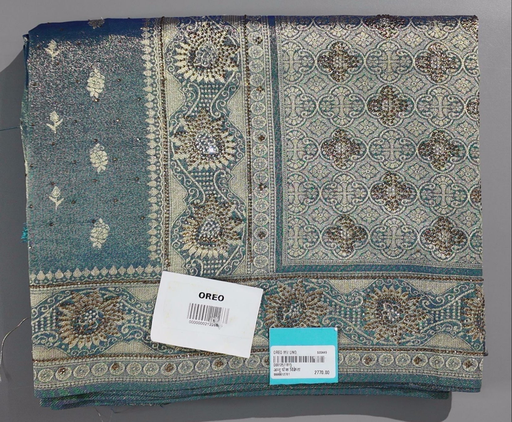 Enchanting Teal Banarasi Saree with Intricate Zari Details",