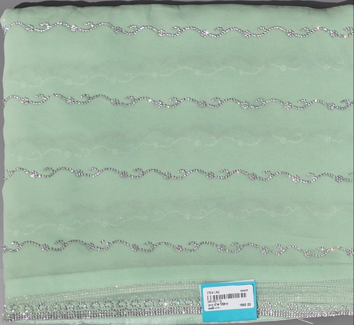 Mint Green Charm: Georgette Saree with Sequined Waves",
