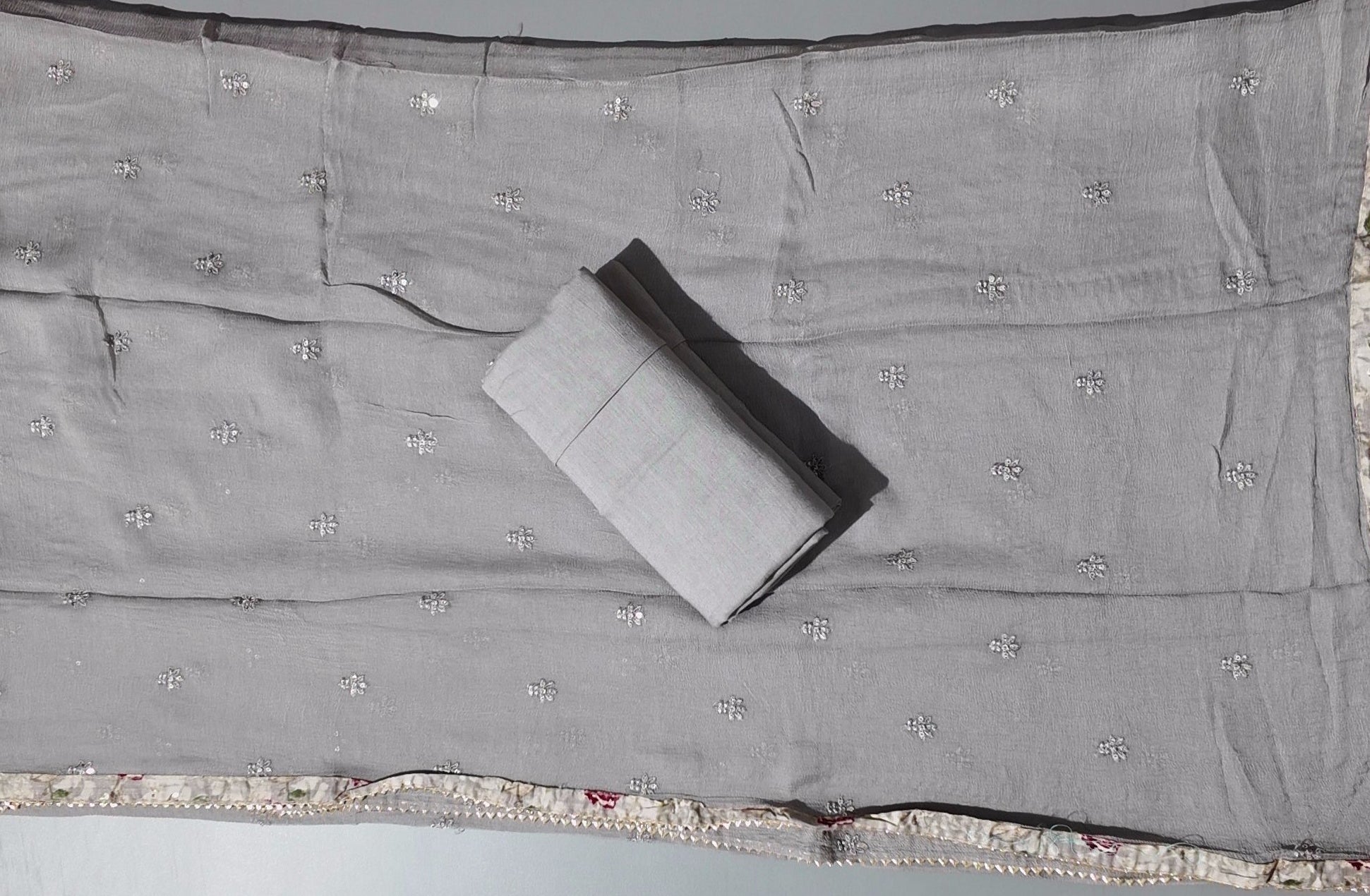 Graceful Grey Unstitched Suit with Intricate Floral Accents",