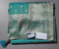 Luxe Teal Heritage Saree with Intricate Silver Weave",