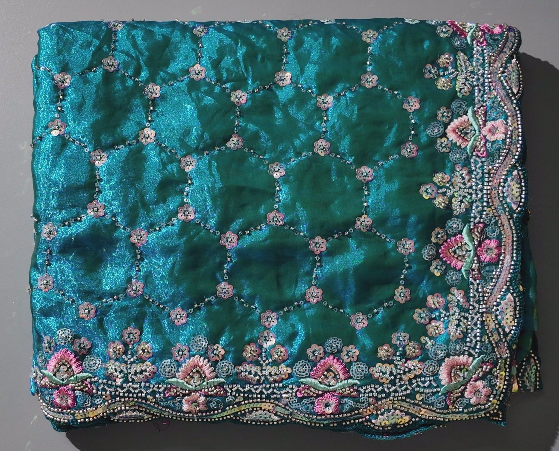 Radiant Teal Dream: Embroidered Floral Extravaganza Saree",