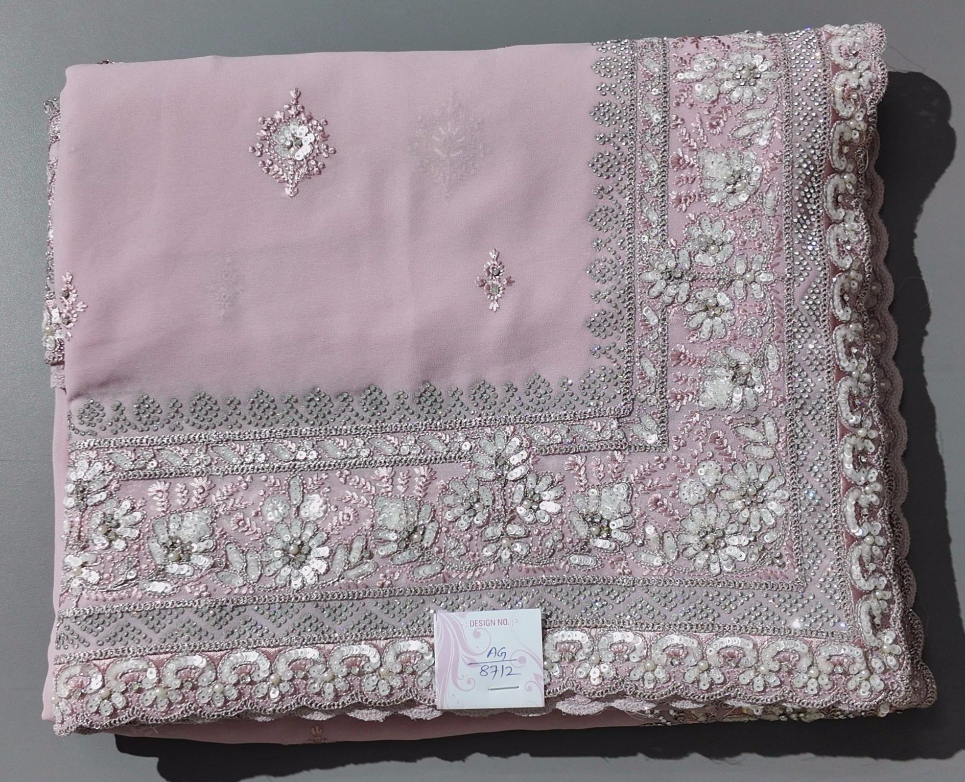 Blossom Whisper: Enchanting Pink Embroidered Saree",