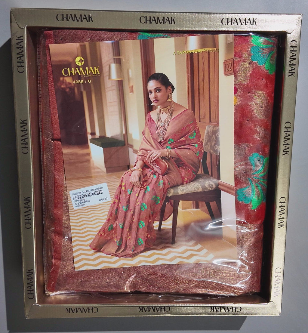 Radiant Rust Floral Saree with Intricate Green Accents",