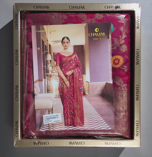 Festive Glamour: Rich Pink Saree with Artistic Patterns",