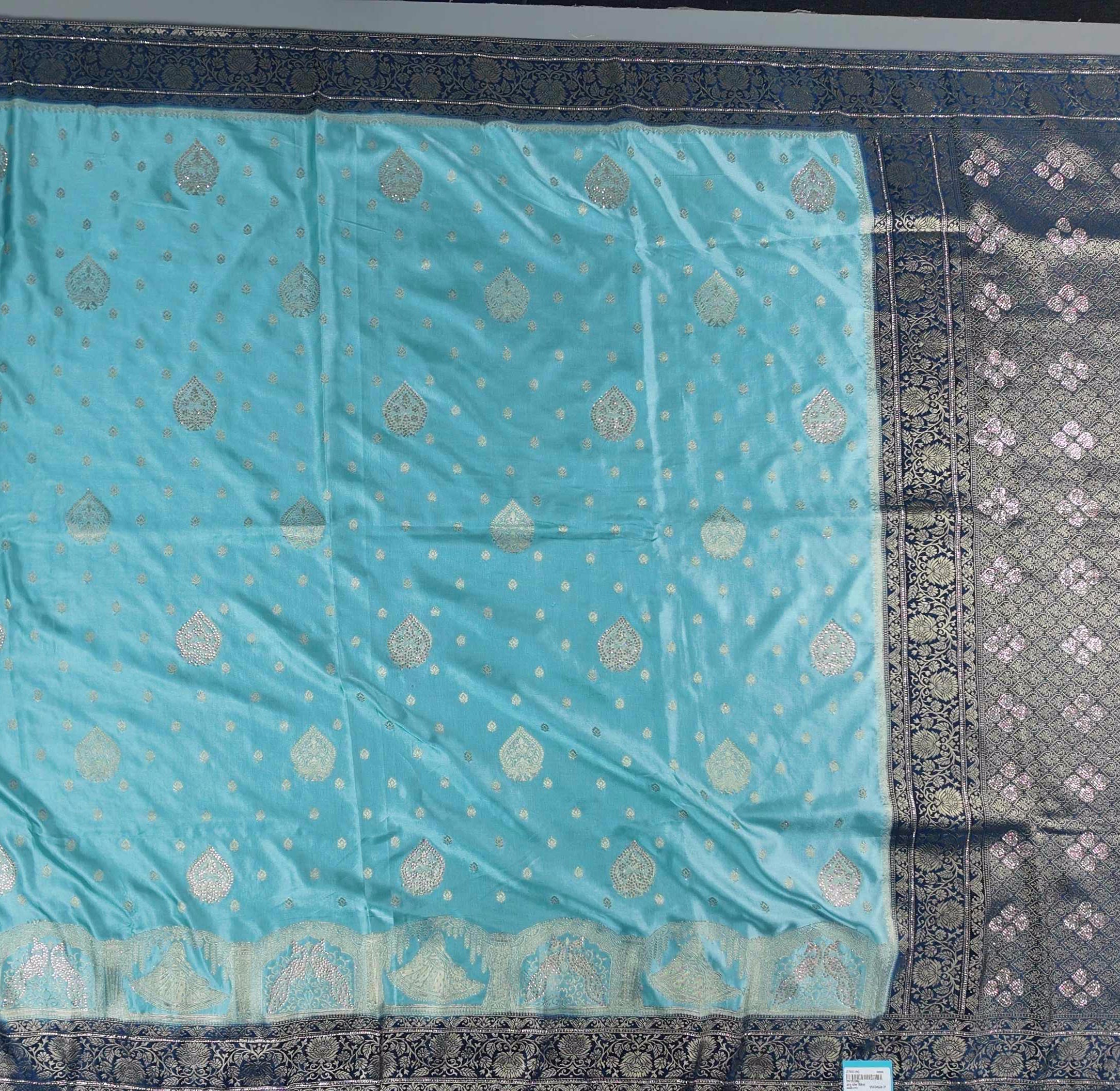 Ethereal Aqua Blue Brocade Saree with Intricate Silver Motifs",