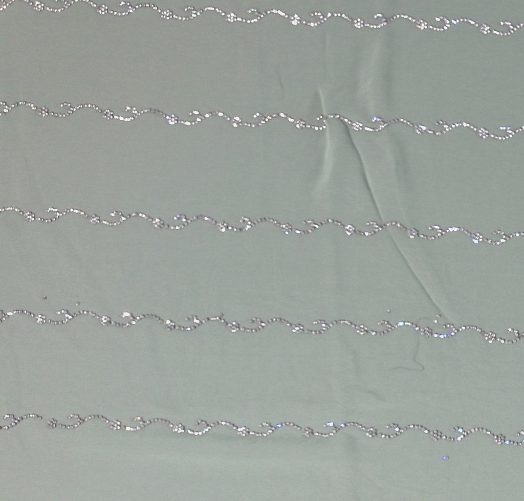 Mint Green Charm: Georgette Saree with Sequined Waves",