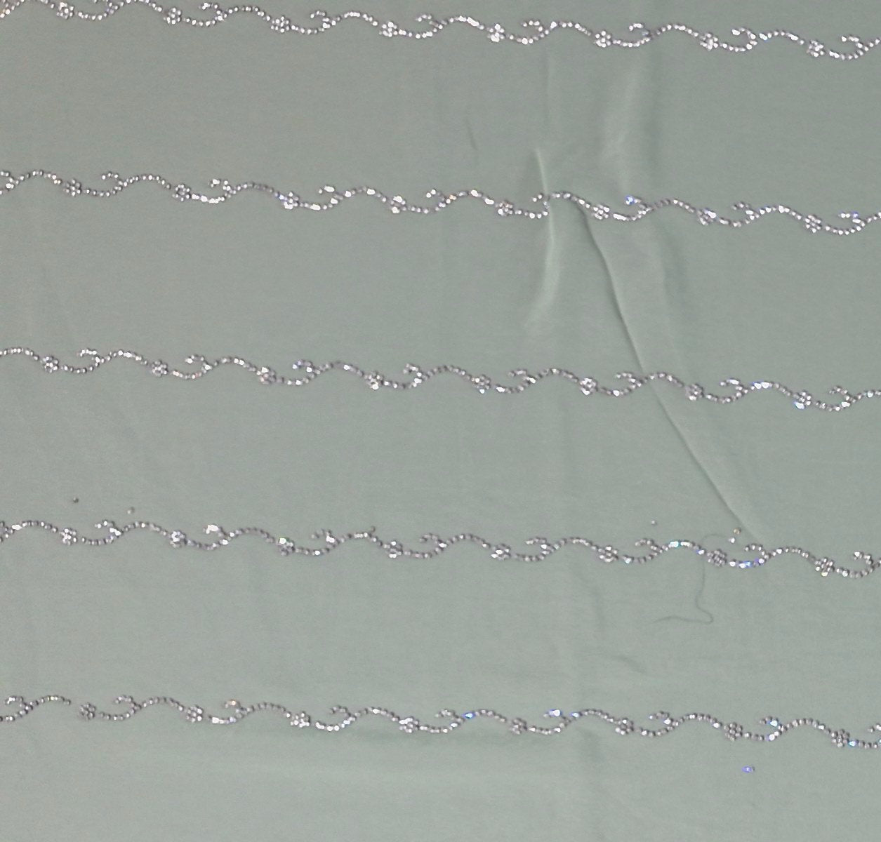 Mint Green Charm: Georgette Saree with Sequined Waves",