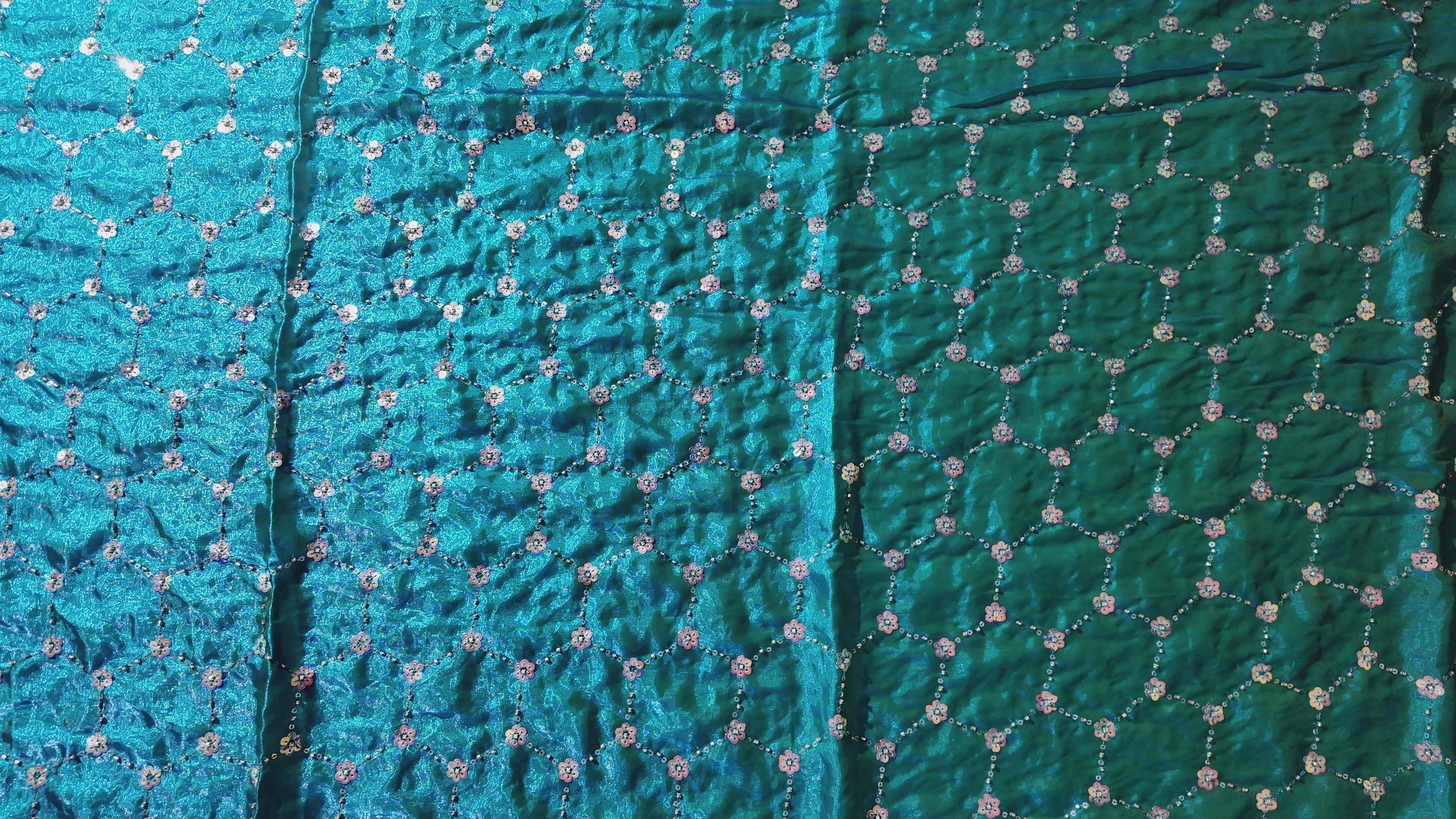 Radiant Teal Dream: Embroidered Floral Extravaganza Saree",
