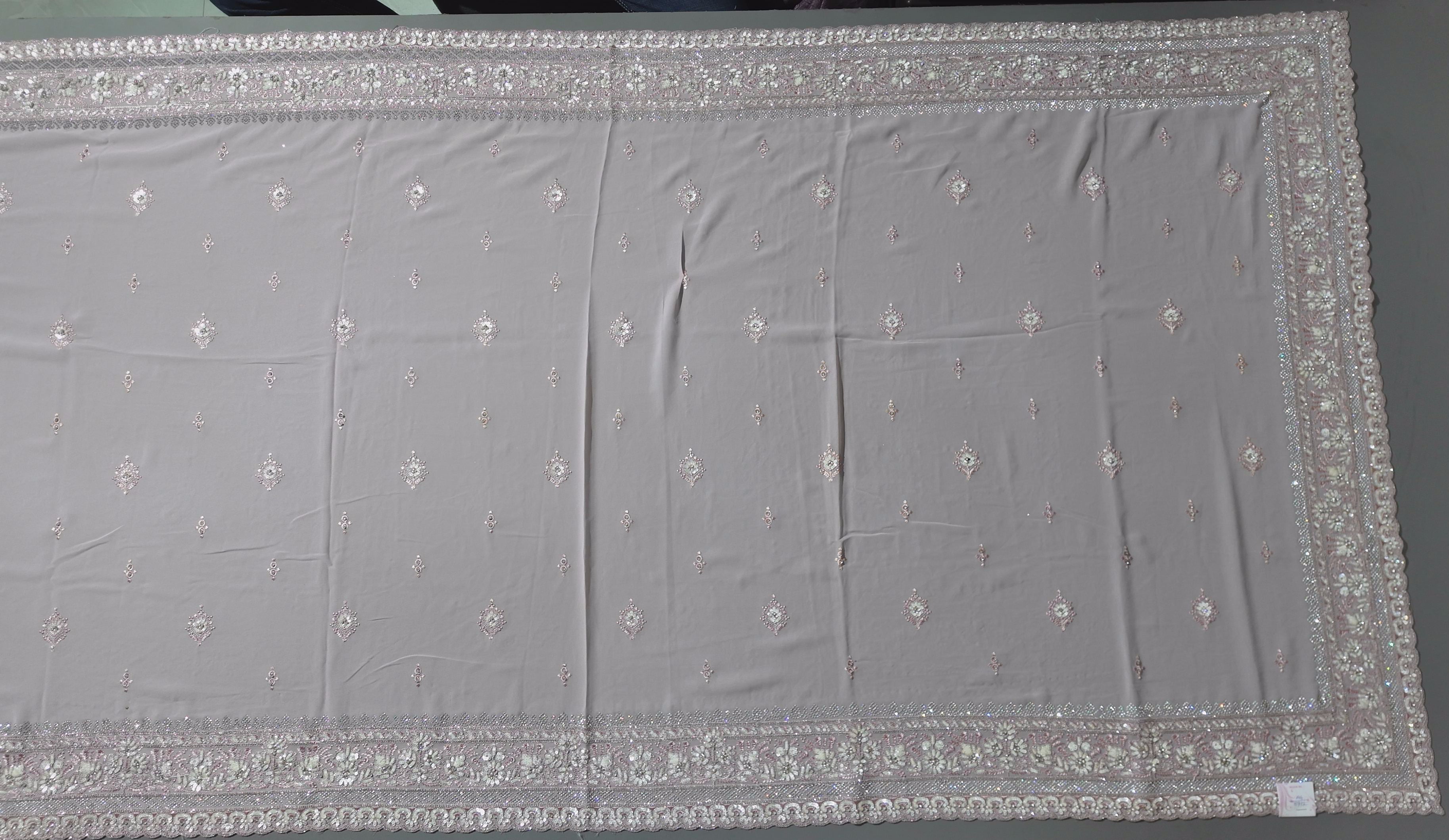 Blossom Whisper: Enchanting Pink Embroidered Saree",