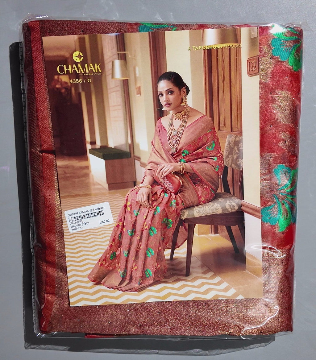 Radiant Rust Floral Saree with Intricate Green Accents",