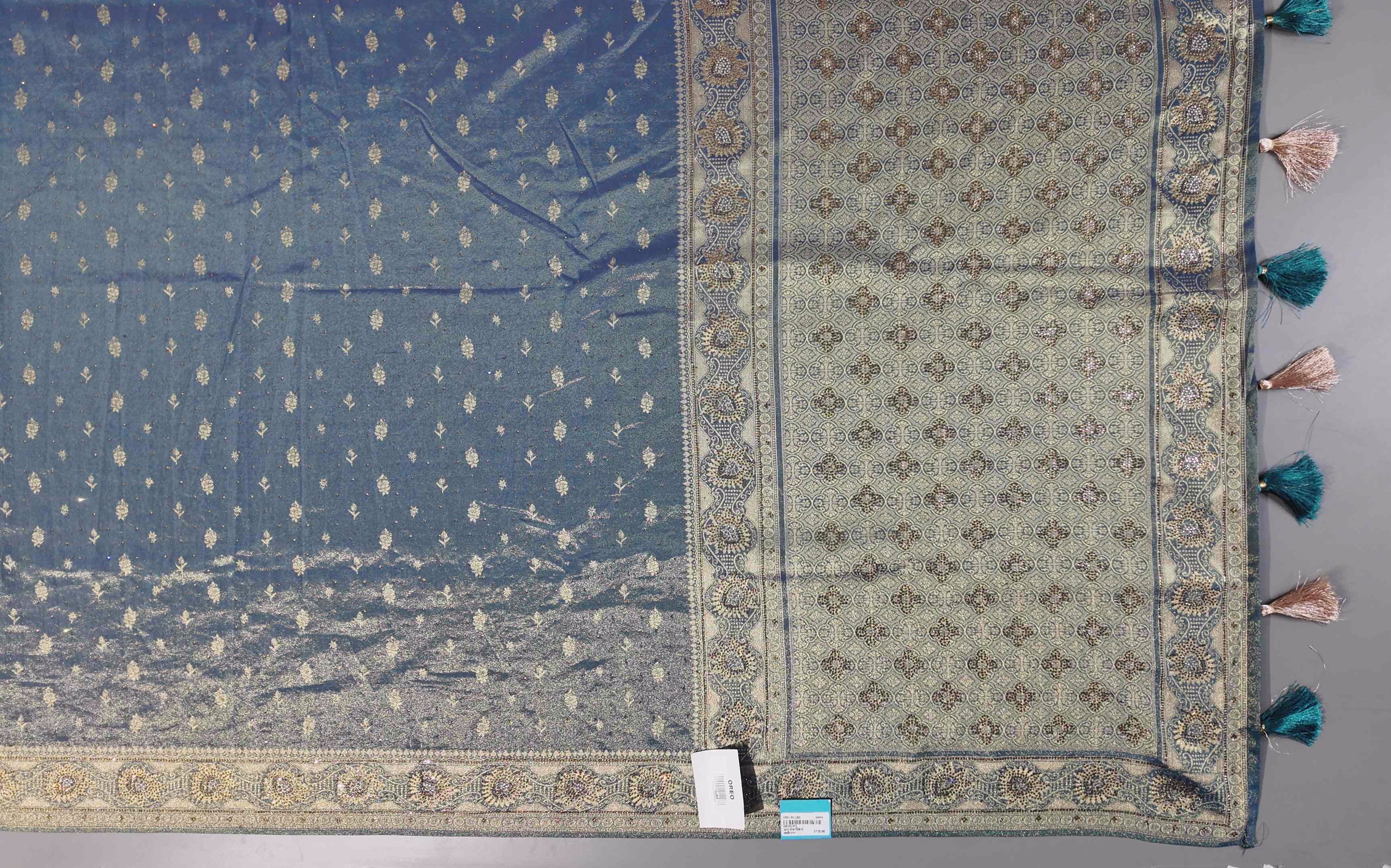 Enchanting Teal Banarasi Saree with Intricate Zari Details",