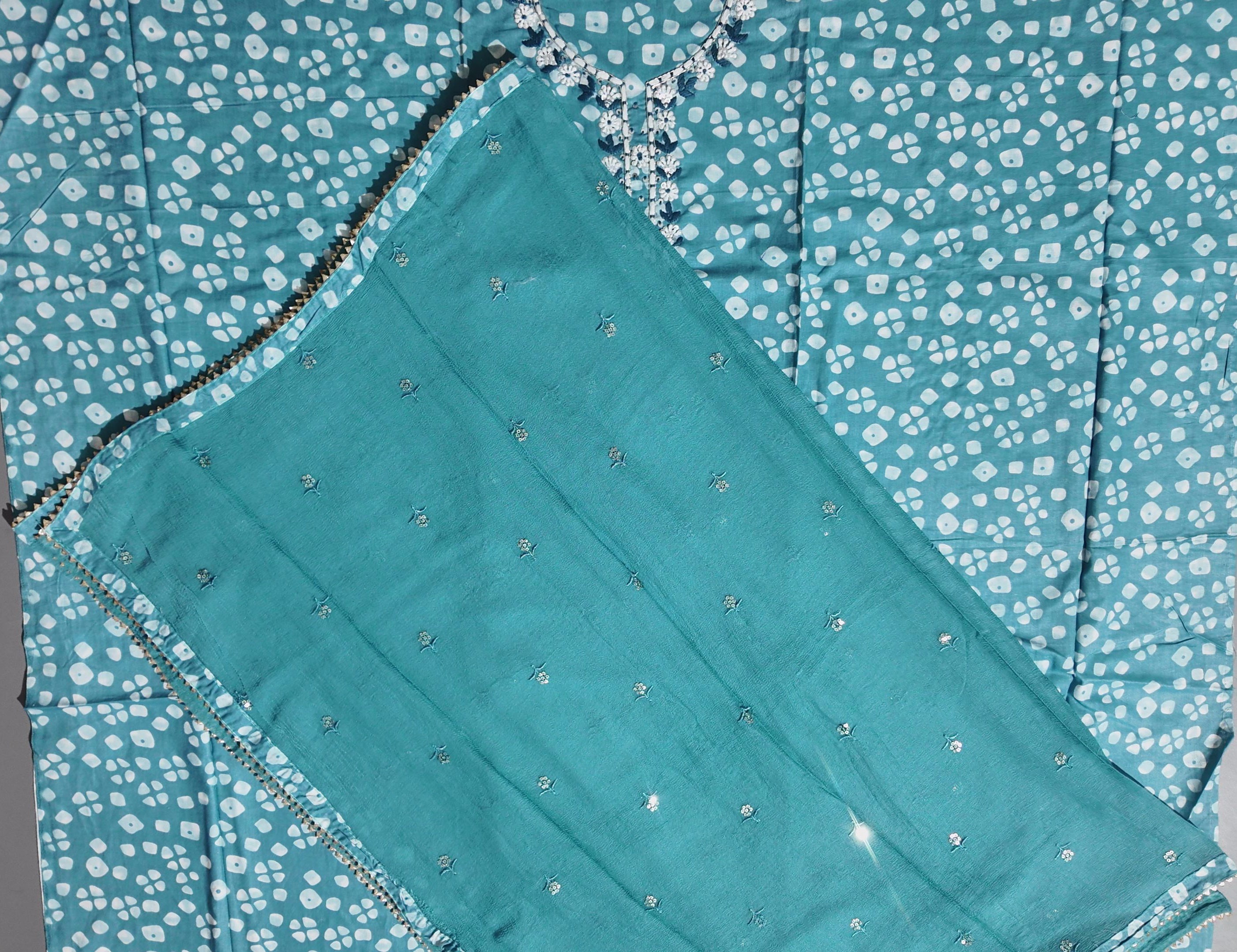 Aqua Blossoms: Unstitched Suit with Floral Embroidered Charm",