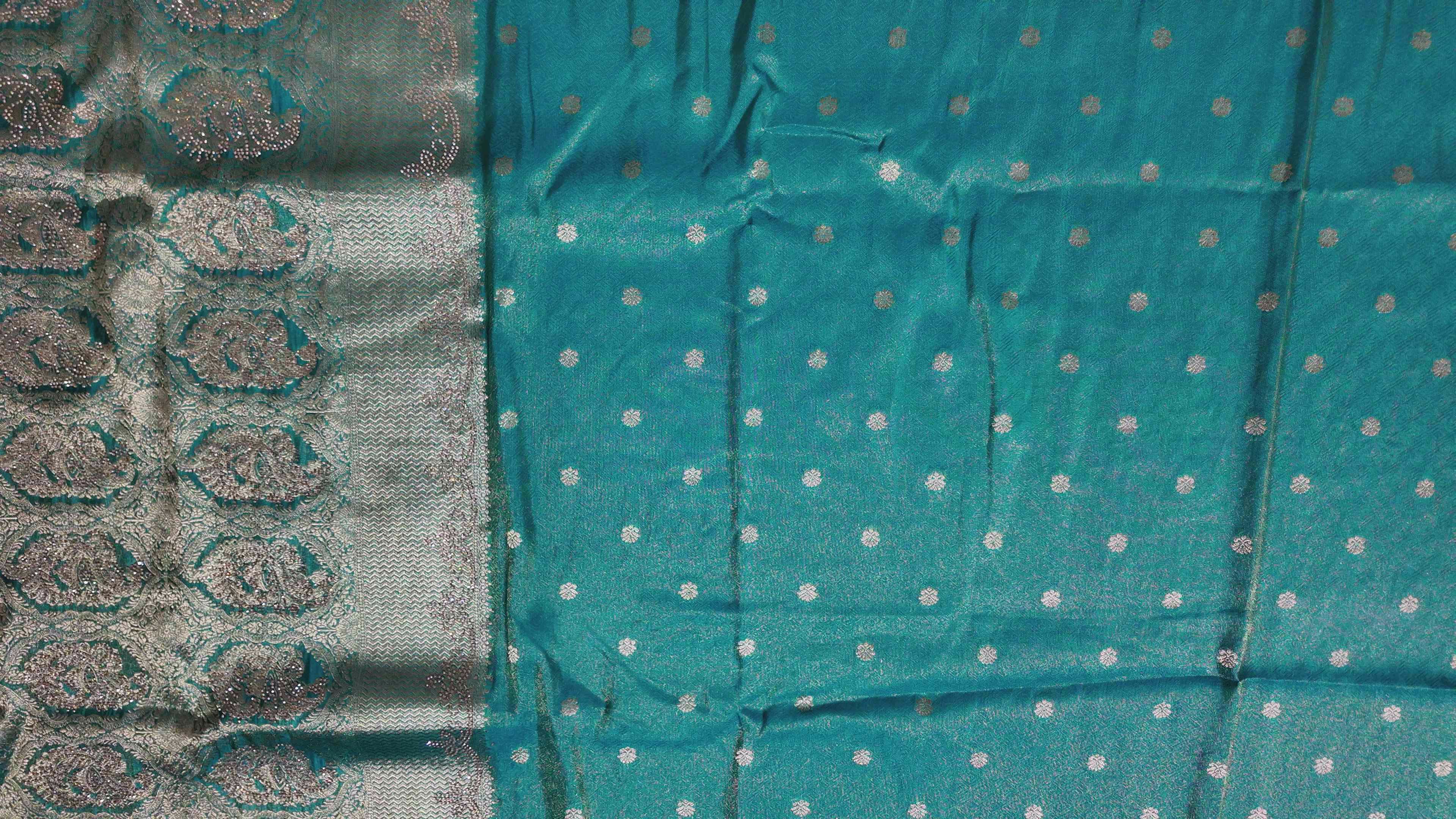 Luxe Teal Heritage Saree with Intricate Silver Weave",