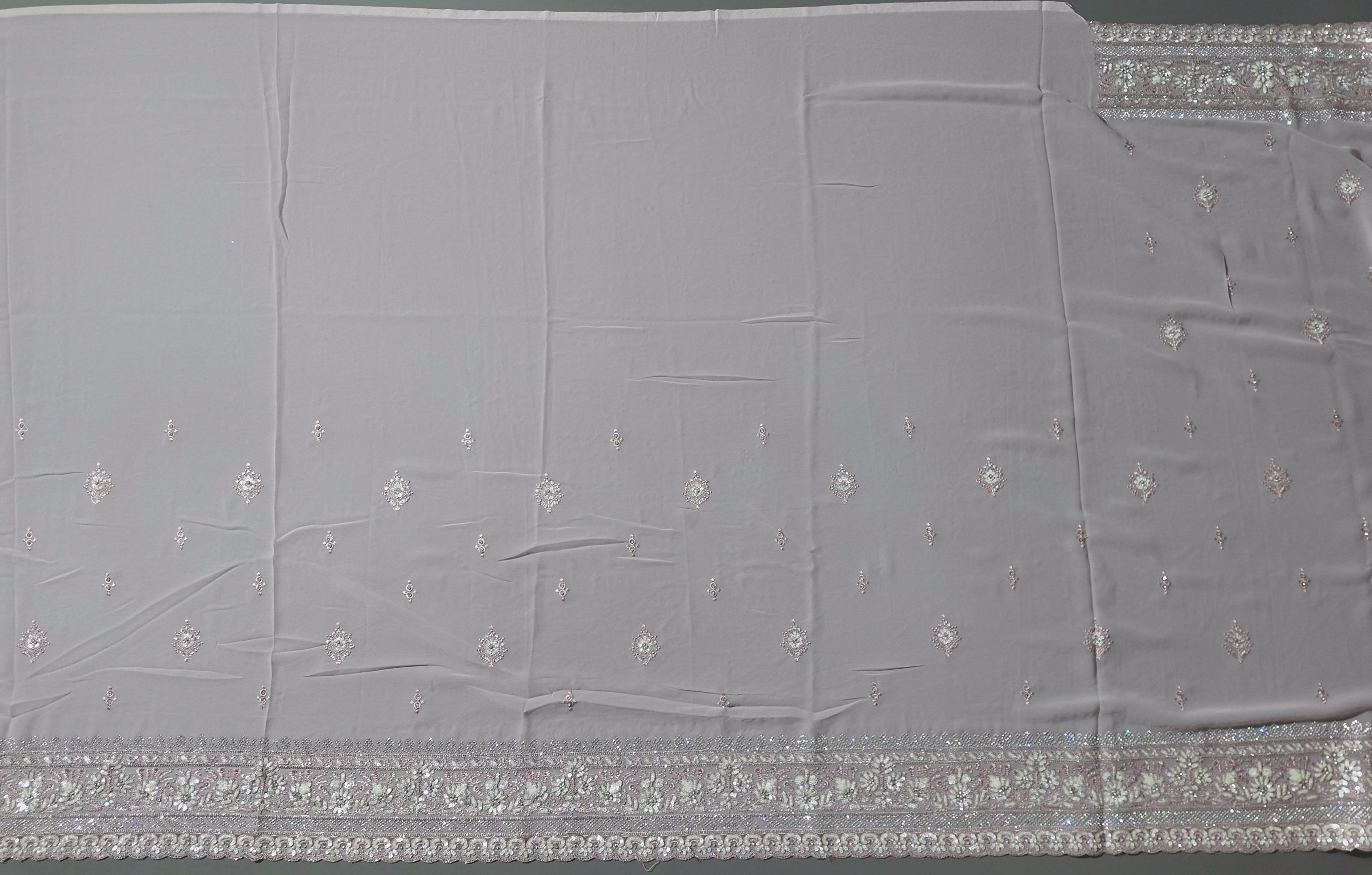 Blossom Whisper: Enchanting Pink Embroidered Saree",