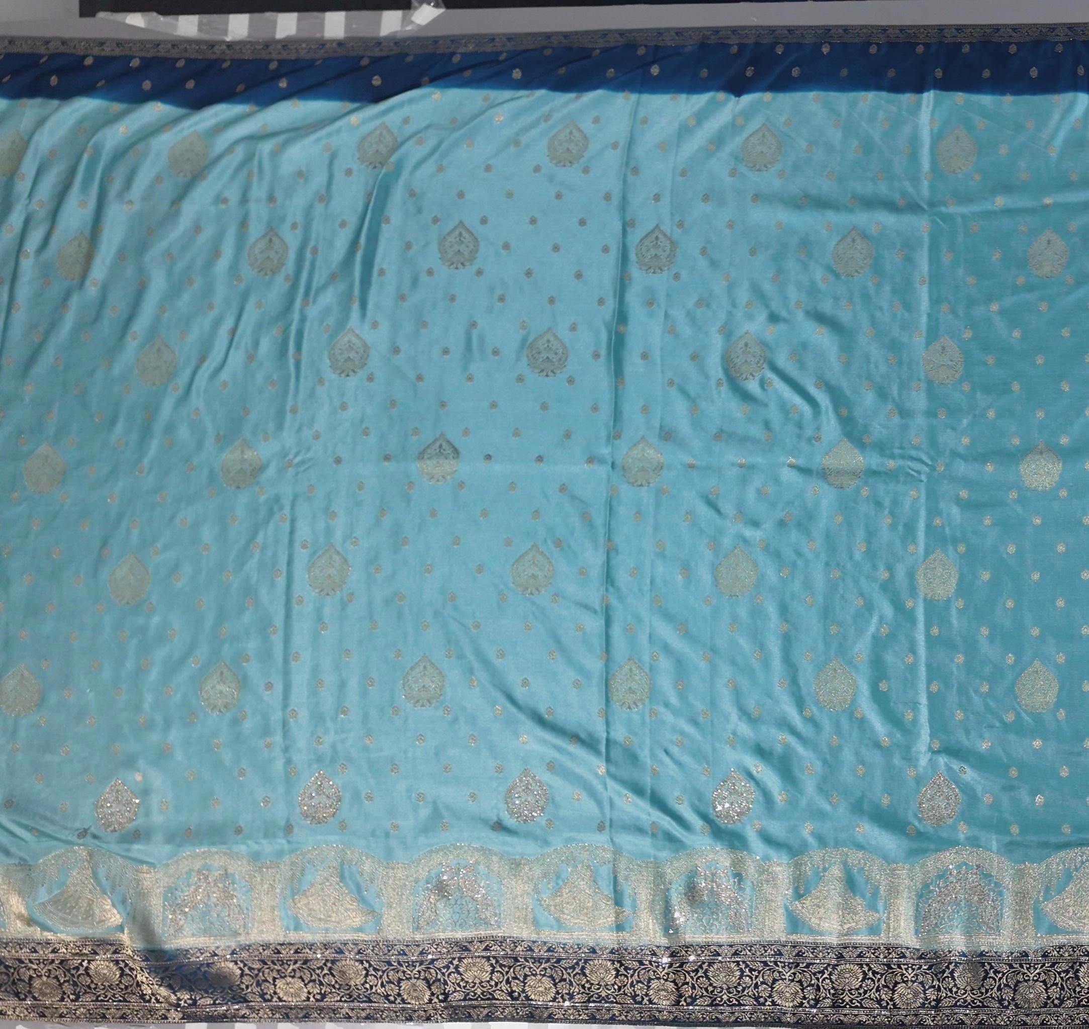 Ethereal Aqua Blue Brocade Saree with Intricate Silver Motifs",