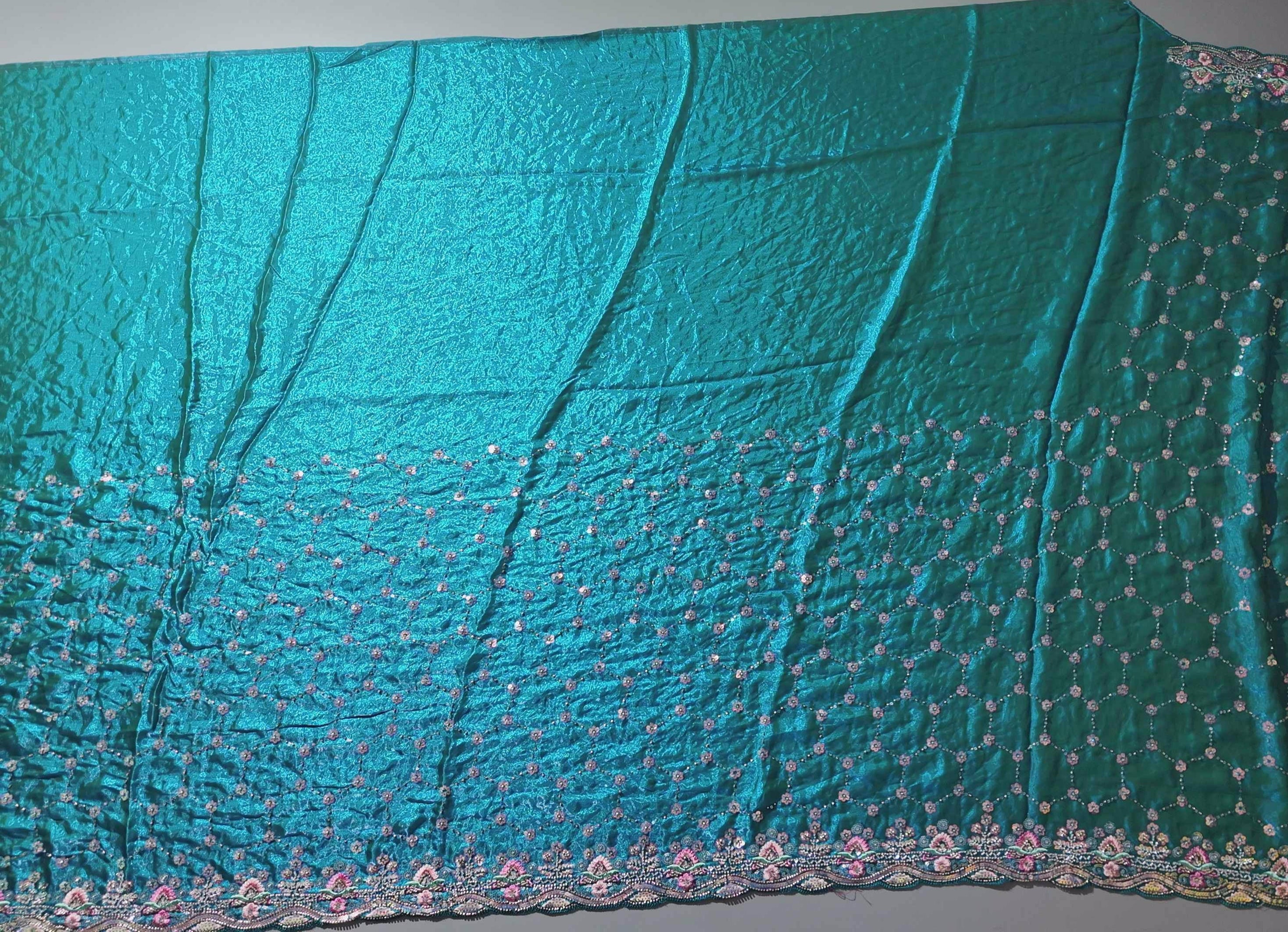 Radiant Teal Dream: Embroidered Floral Extravaganza Saree",