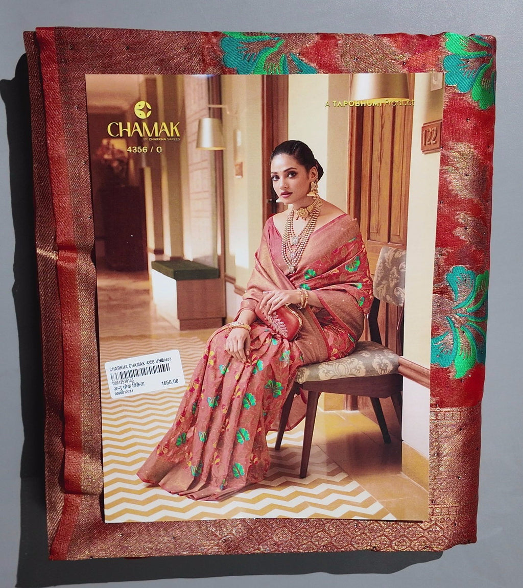 Radiant Rust Floral Saree with Intricate Green Accents",