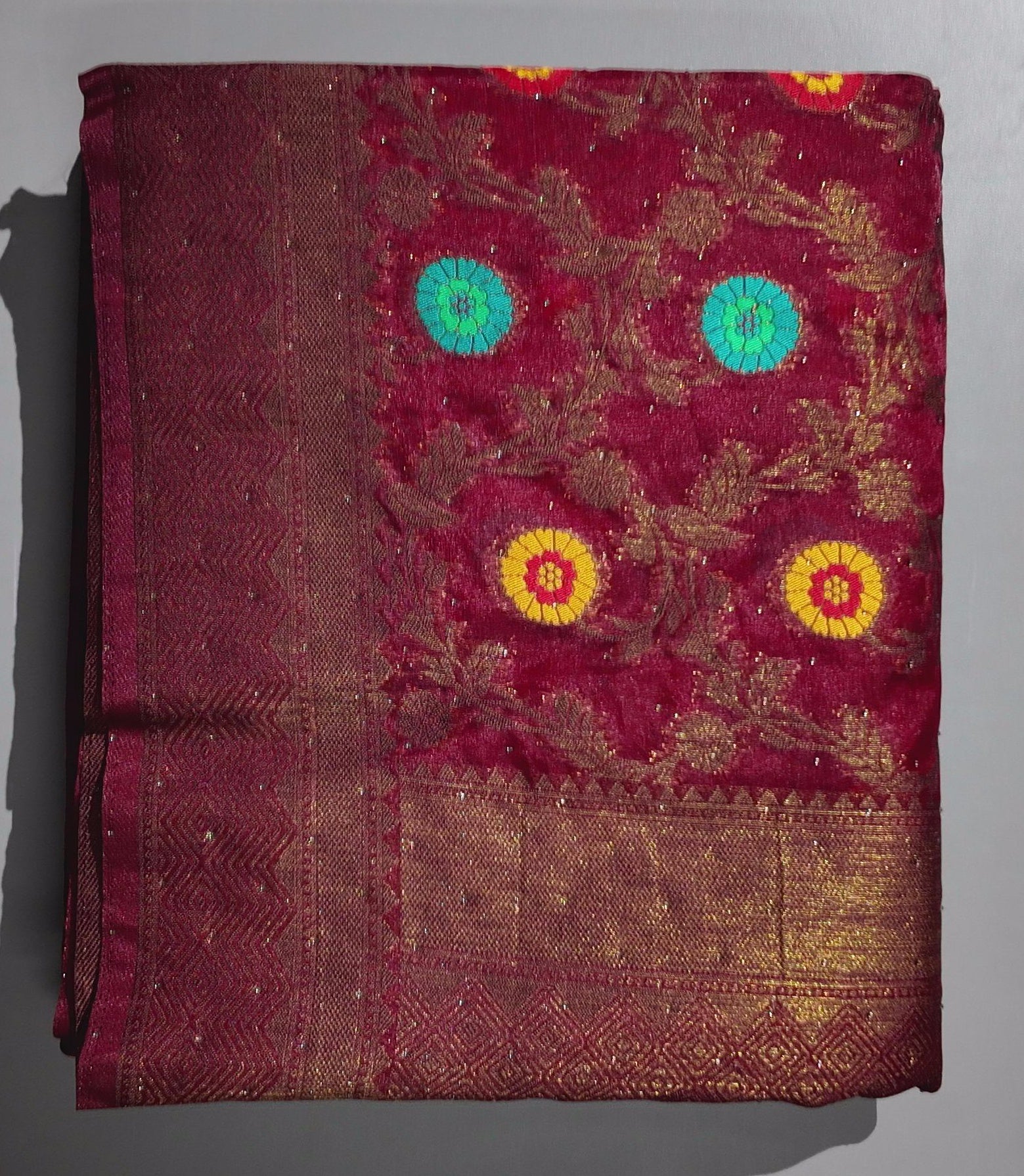 Opulent Maroon Silk Saree with Intricate Floral Motifs",