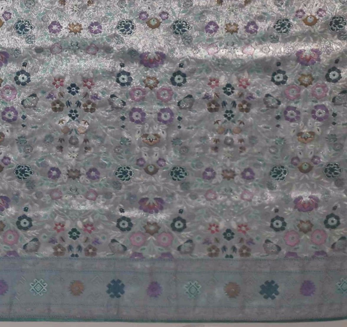 Opulent Silver & Teal Tapestry Saree with Intricate Mosaic Patterns",