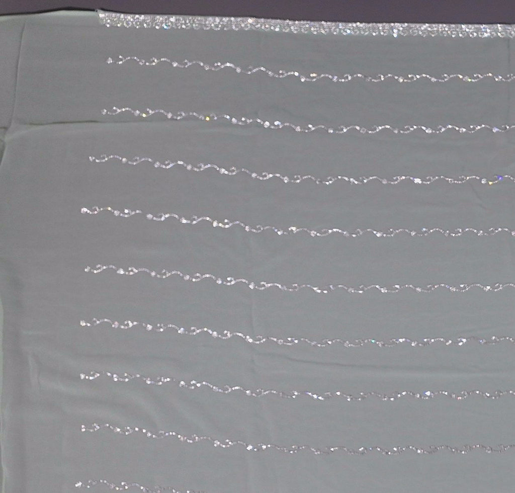 Mint Green Charm: Georgette Saree with Sequined Waves",