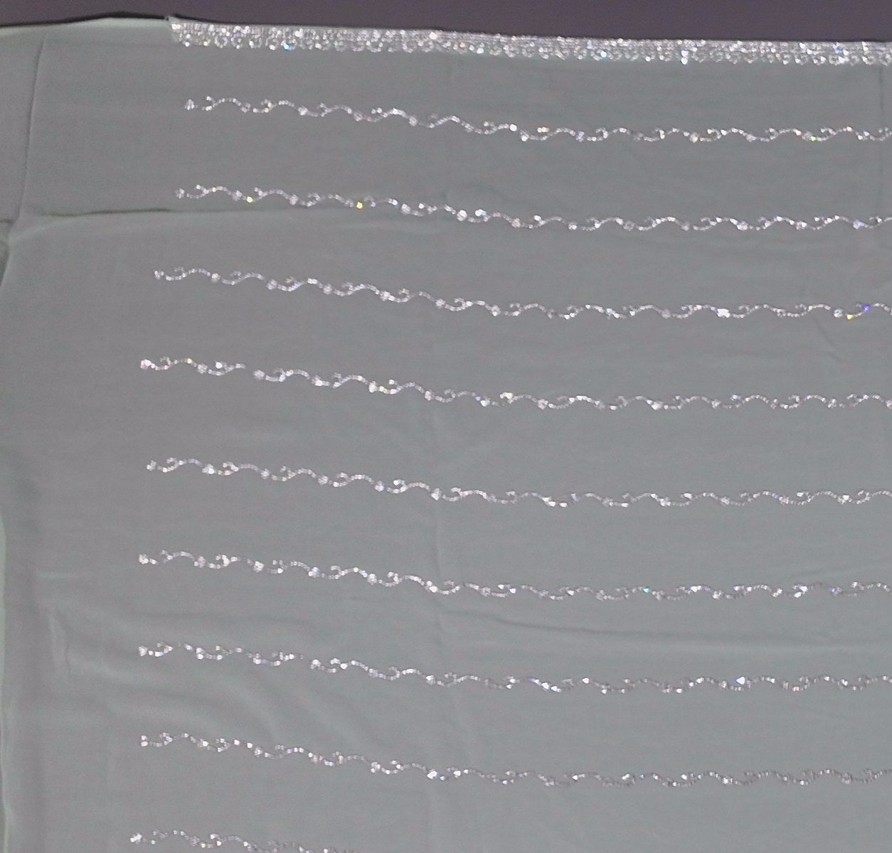 Mint Green Charm: Georgette Saree with Sequined Waves",