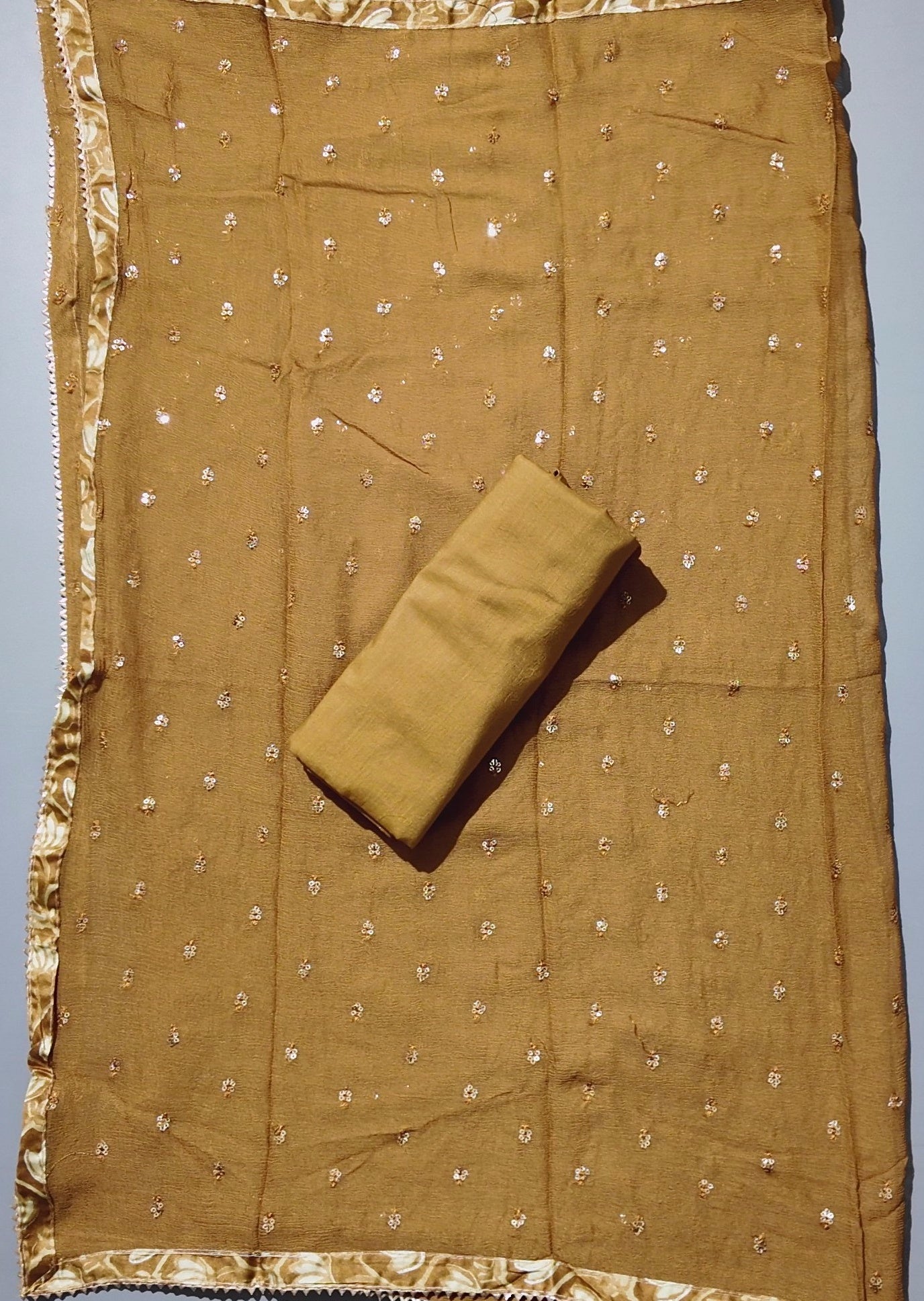 Golden Blossom Unstitched Suit: Embrace Elegant Embroidery",