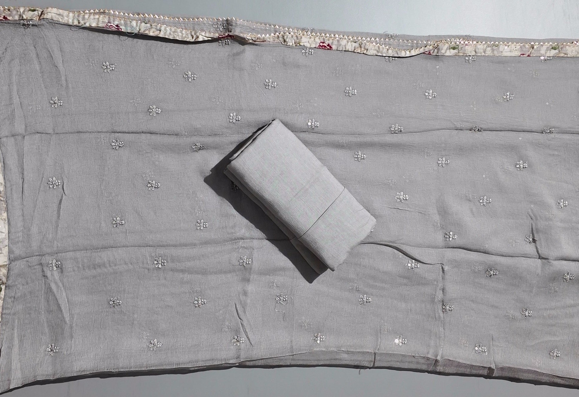 Charming Floral Unstitched Suit with Shimmer Detail",