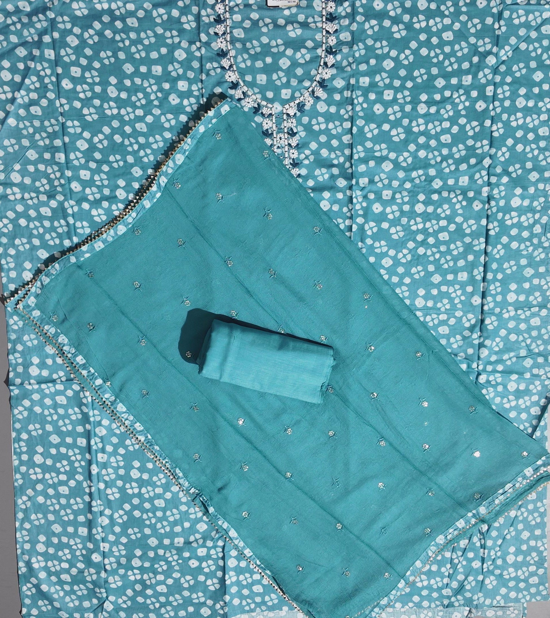 Aqua Blossoms: Unstitched Suit with Floral Embroidered Charm",