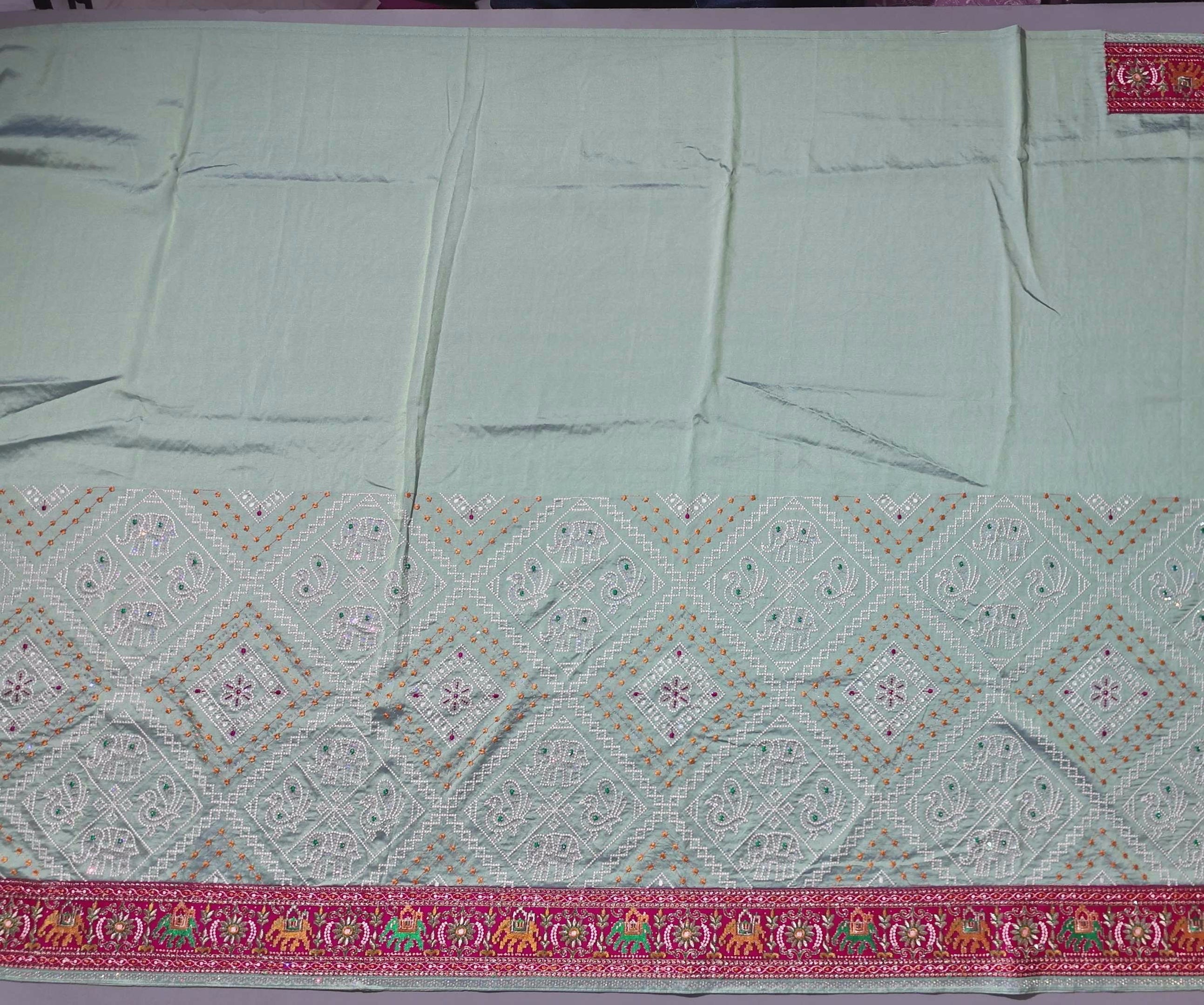 Festive Radiance: Vibrant Embroidered Silk Saree",