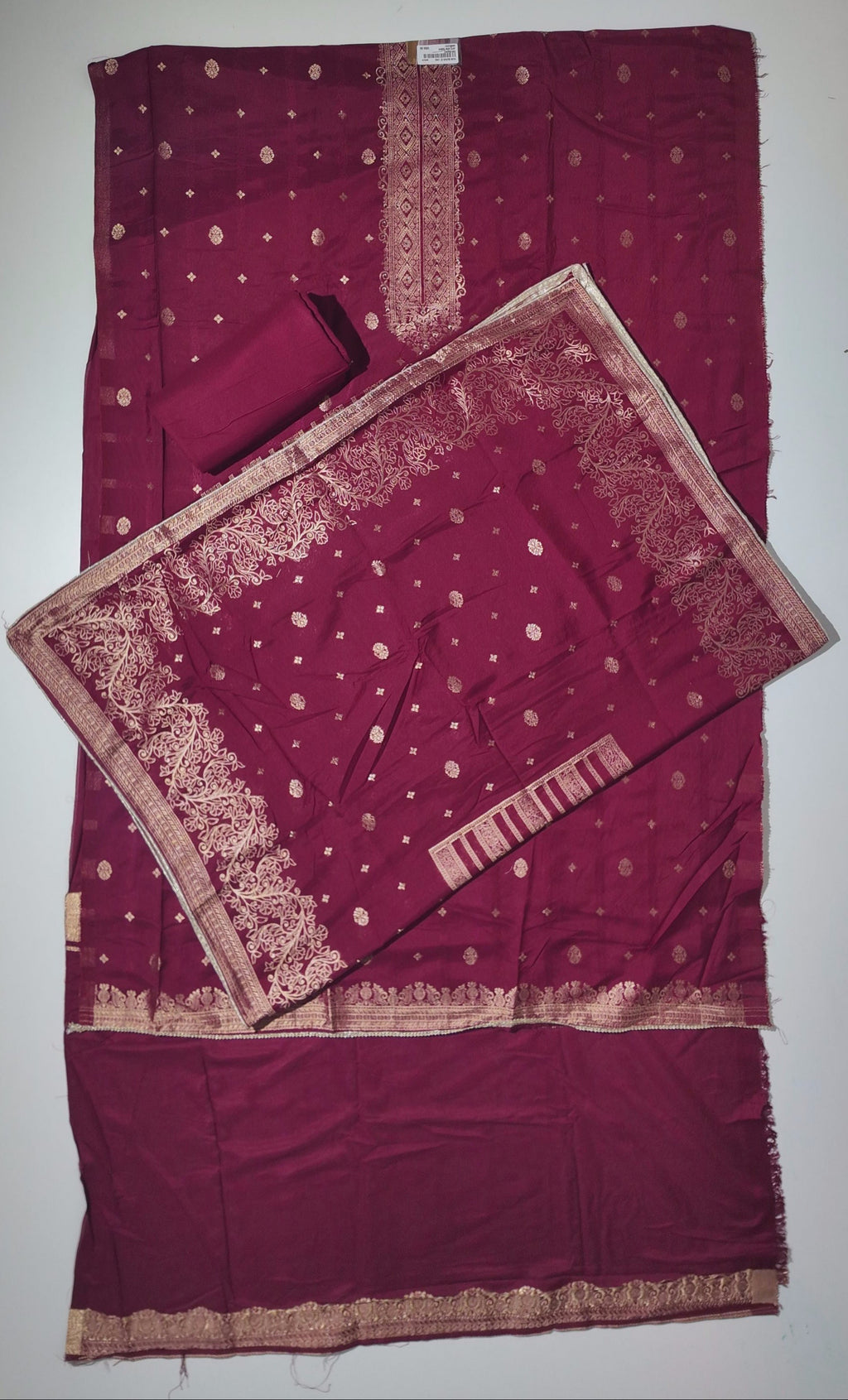 Rich Maroon Unstitched Suit with Intricate Ethnic Patterns