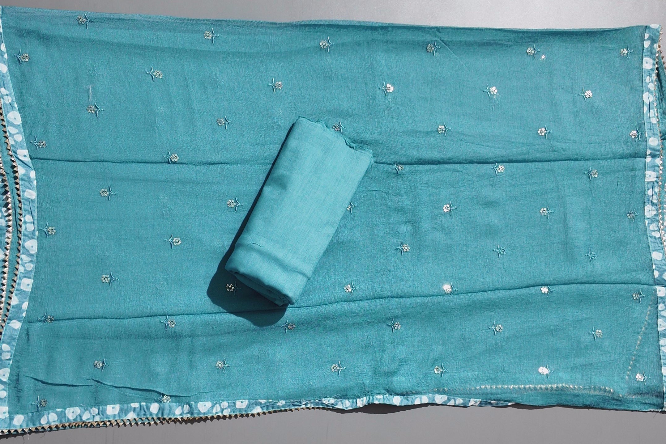 Charming Teal Unstitched Suit with Floral Embroidery