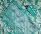 Serene Aqua Blossoms: Unstitched Suit with Intricate Lace