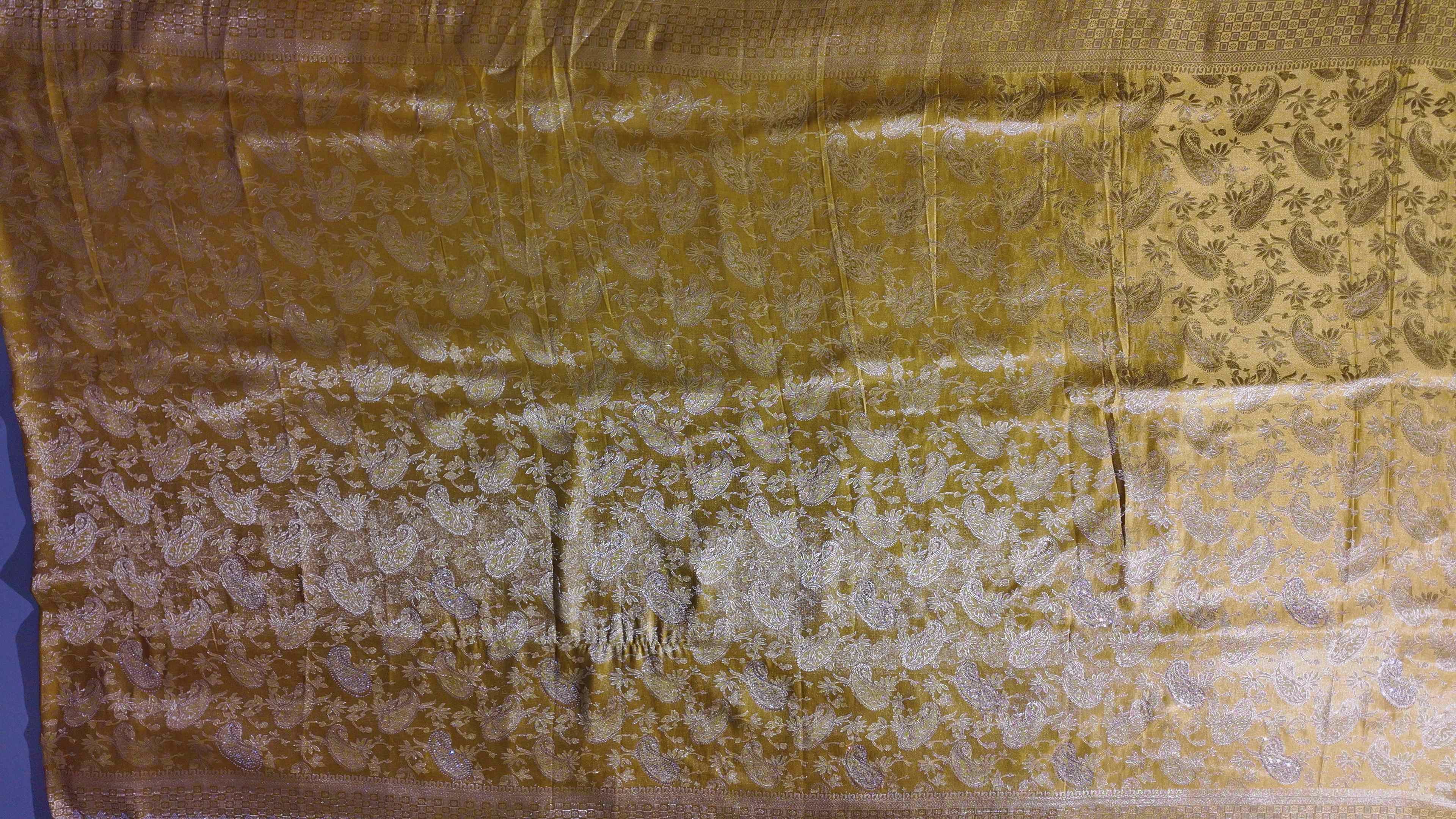 Golden Aura Unstitched Suit: Radiate Glamour on Festive Days",