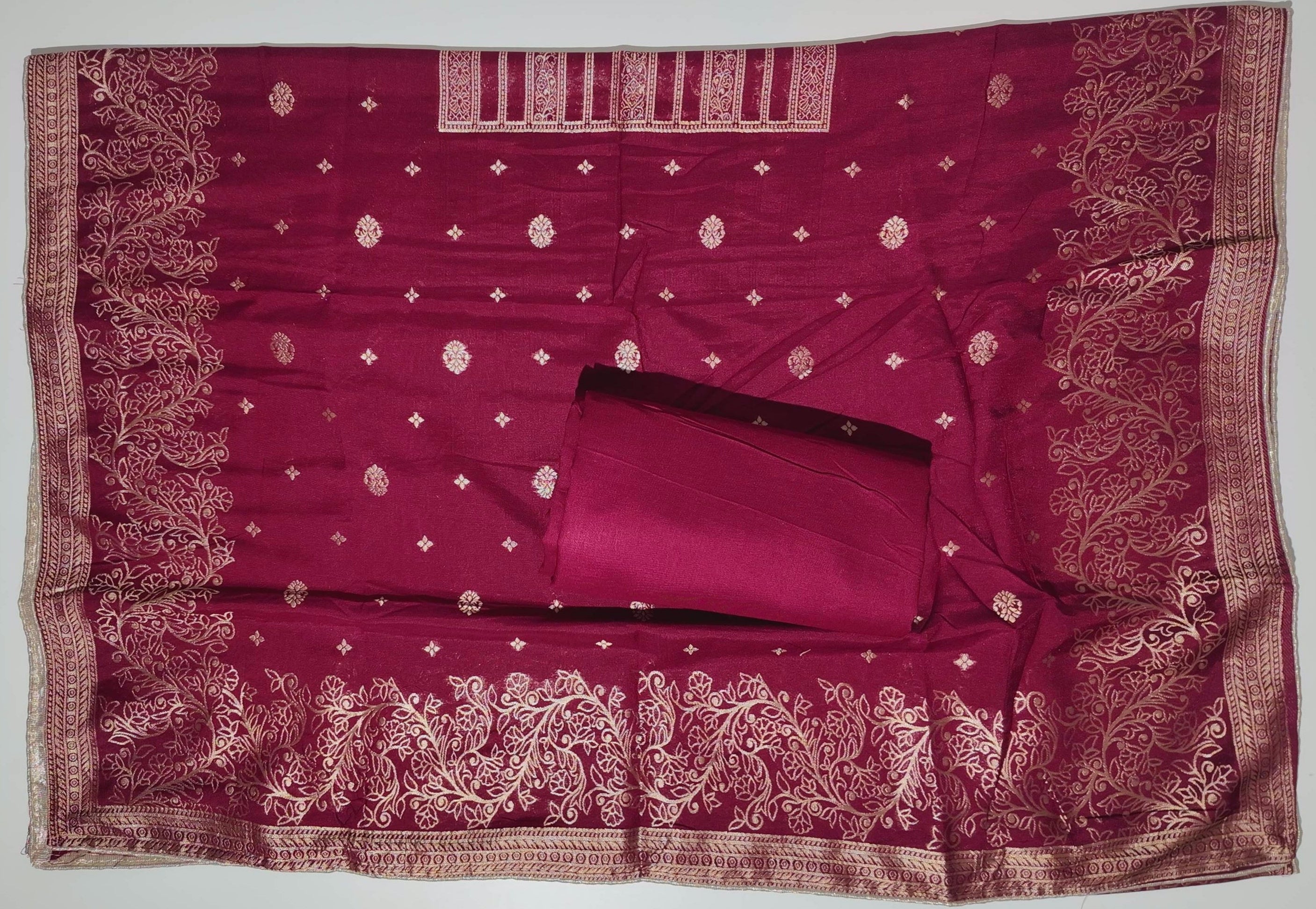 Rich Maroon Unstitched Suit with Intricate Ethnic Patterns