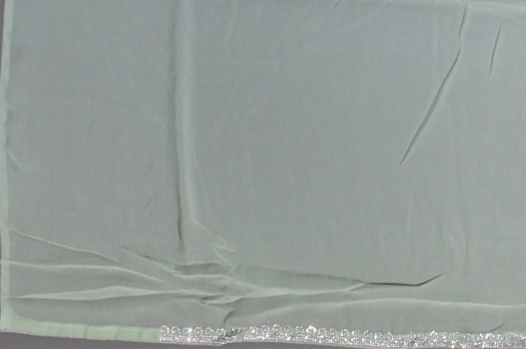 Mint Green Charm: Georgette Saree with Sequined Waves",